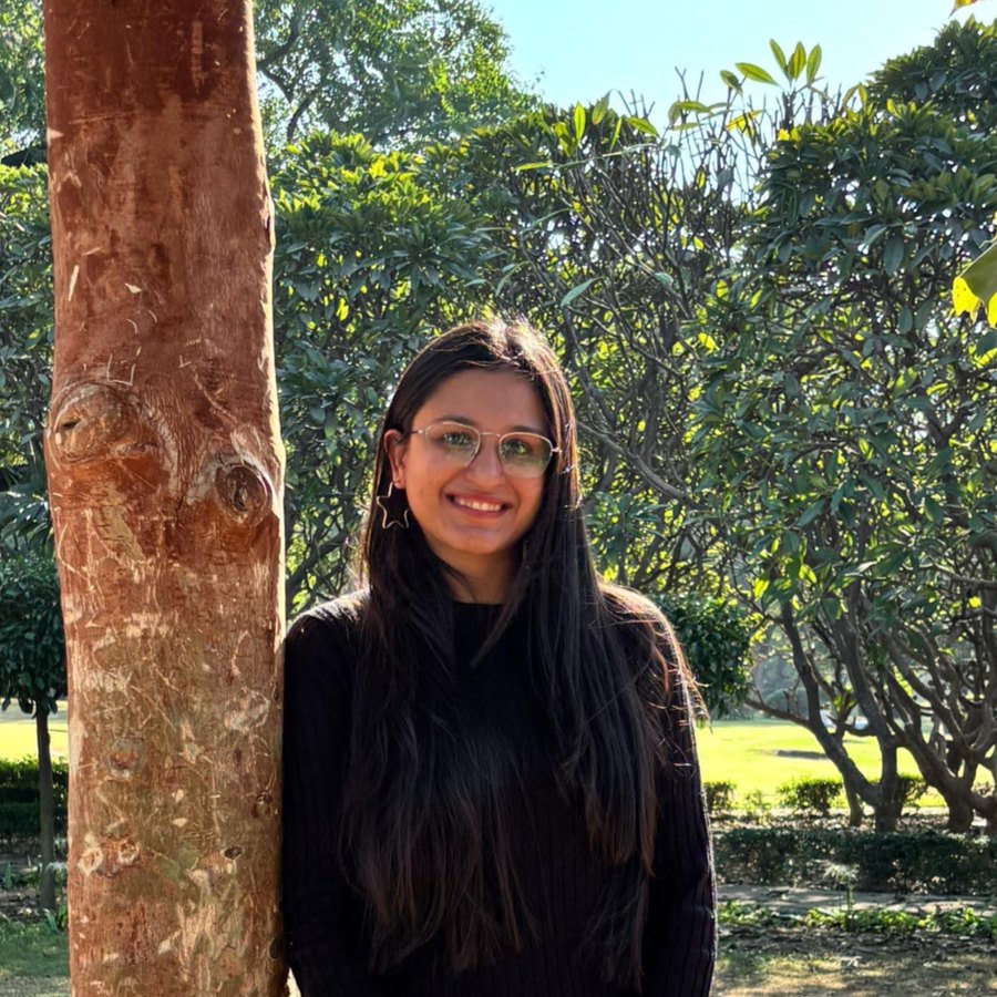 Harpreet Kaur Arora smiling beneath a tree in warm afternoon light