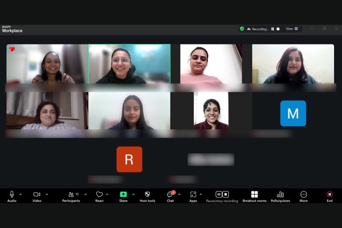 An online circle in progress, participants in winter clothing, the facilitator speaking